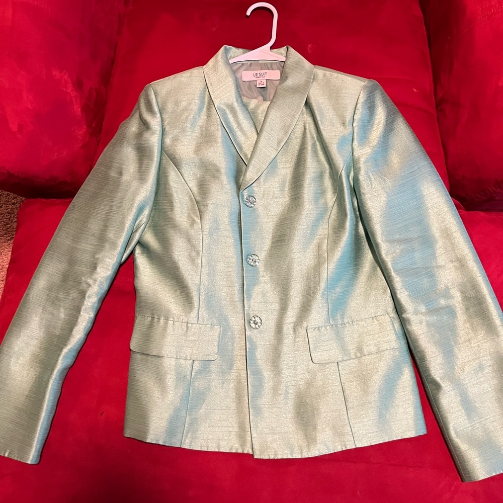 Business suit jacket, matching skirt (below knee).